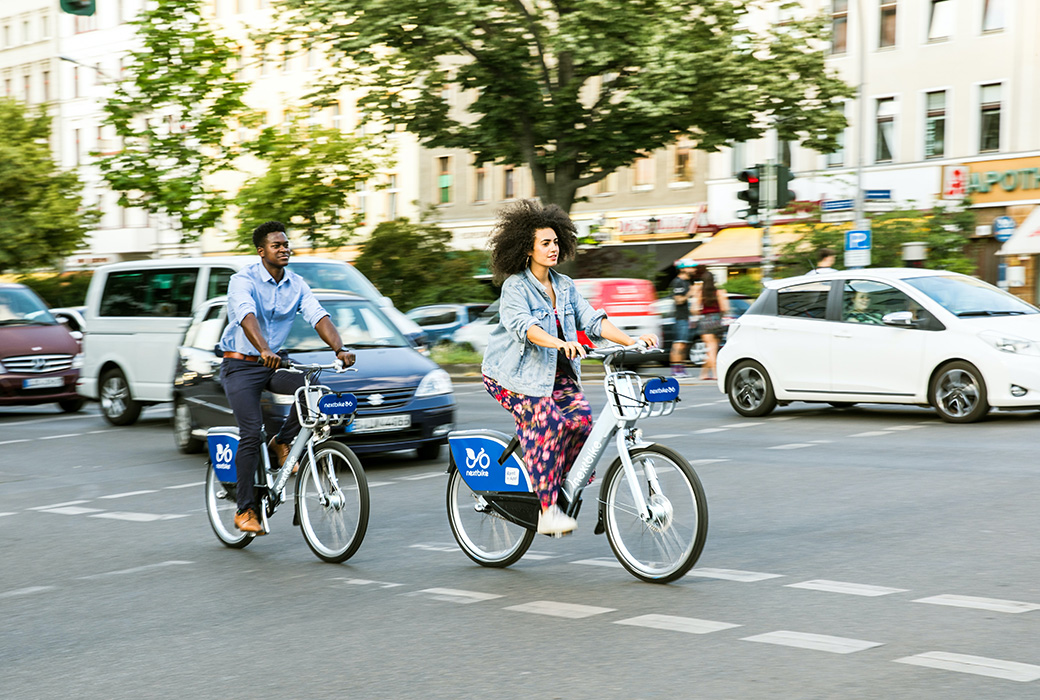 People riding hire bikes